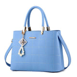 Stylish Women's Handbag with Hair Ball Detail