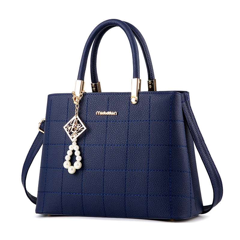 Stylish Women's Handbag with Hair Ball Detail