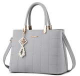 Stylish Women's Handbag with Hair Ball Detail